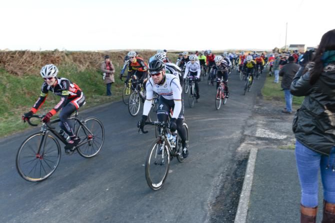 Mark Cavendish leads the group of local riders at the start