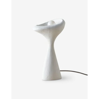 white scupltual table lamp
