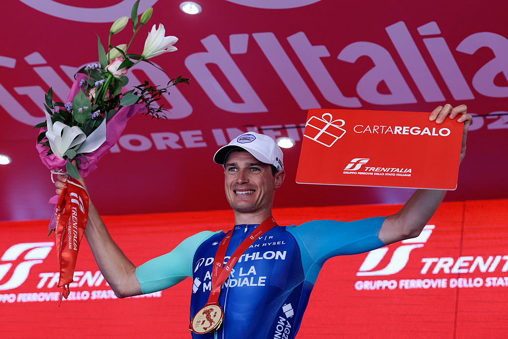 Decathlon AG2R La Mondiale Team's French rider Nicolas Prodhomme celebrates on the podium after victory in the 19th stage of the 108th Giro d'Italia cycling race of 166kms from Biella to Champoluc on May 30, 2025. (Photo by Luca Bettini / AFP)