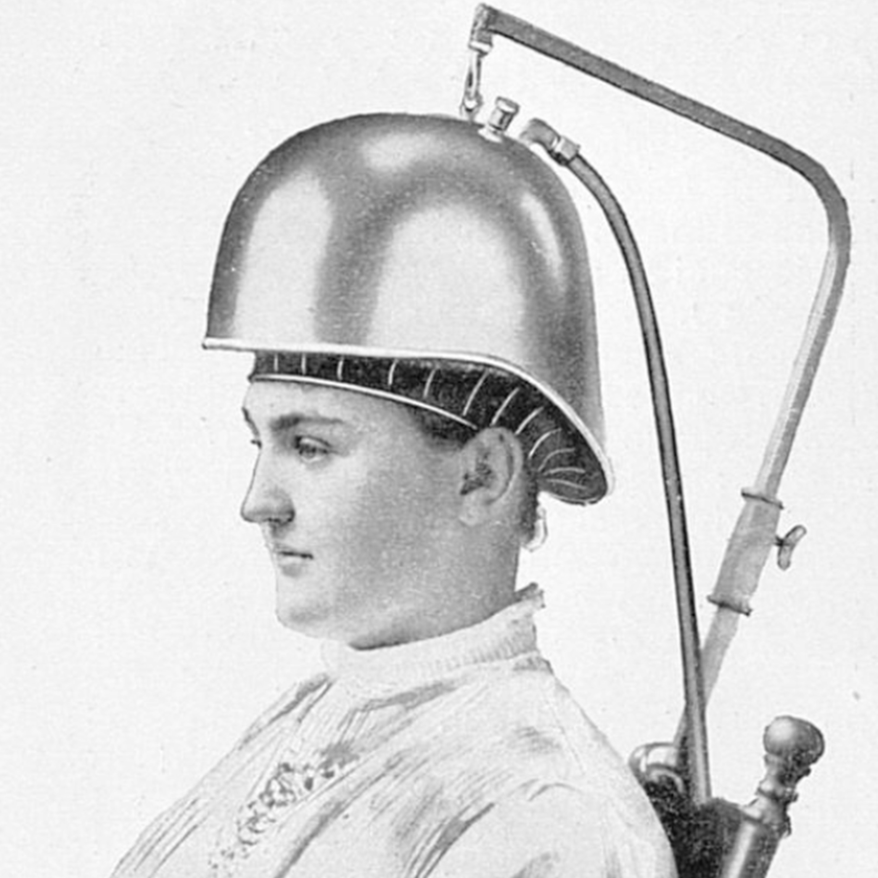 Black and white advert depicting a man wearing a suction helmet 