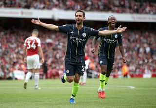Bernardo Silva scores the second as Manchester City start their defence with a 2-0 win at Arsenal