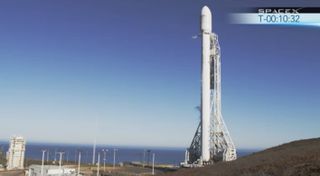 An upgraded SpaceX Falcon 9 rocket stands poised to launch from Space Launch Complex 4 at Vandenberg Air Force Base in California on Sept. 29, 2013.