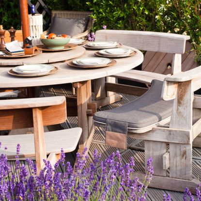 Lavender plantings around outdoor dining table