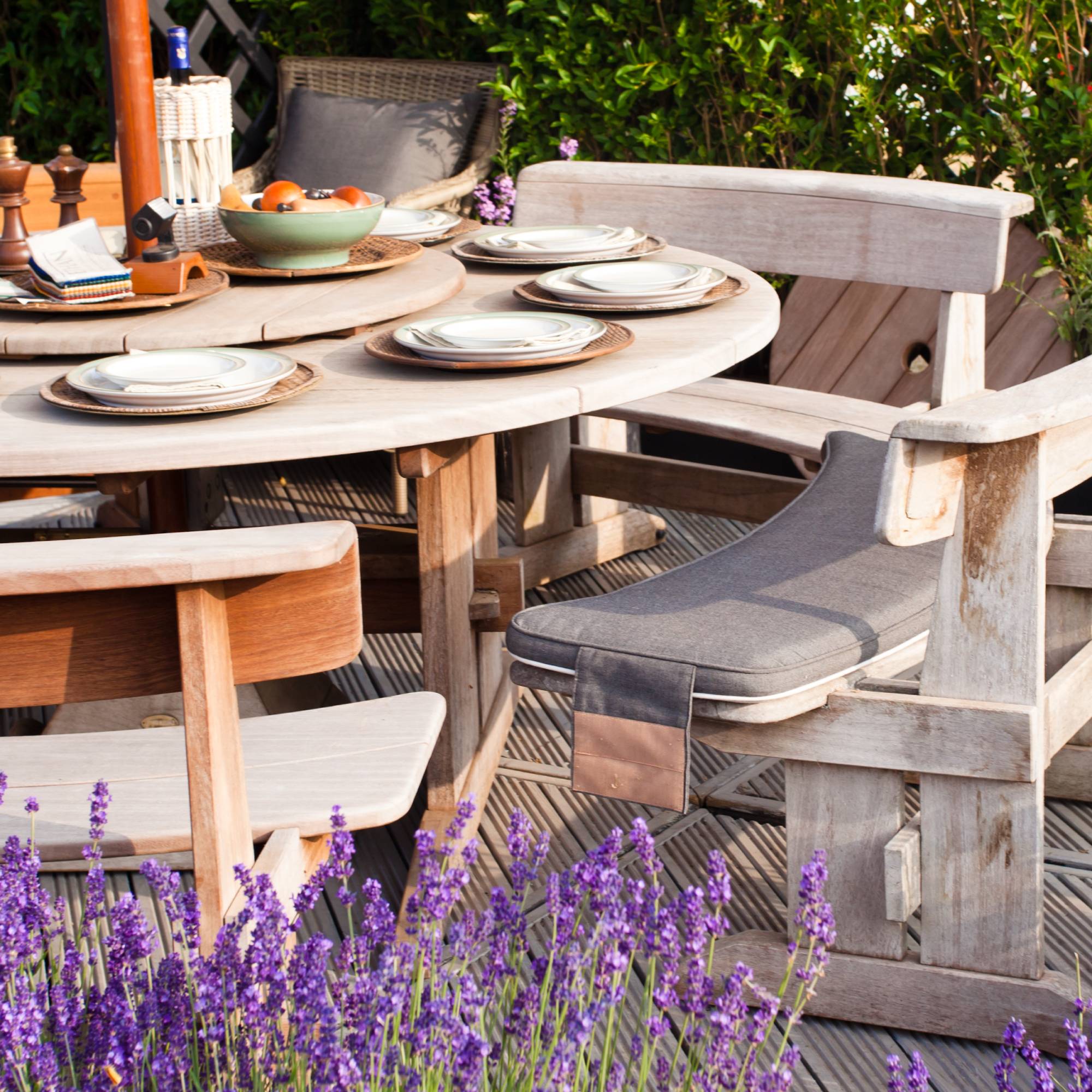 Lavender plantings around outdoor dining table