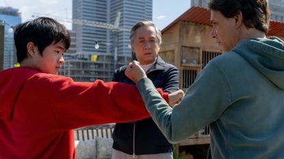 Ben Wang as Li Fong, Jackie Chan as Mr Han, and Ralph Macchio as Daniel LaRusso in Karate Kid: Legends