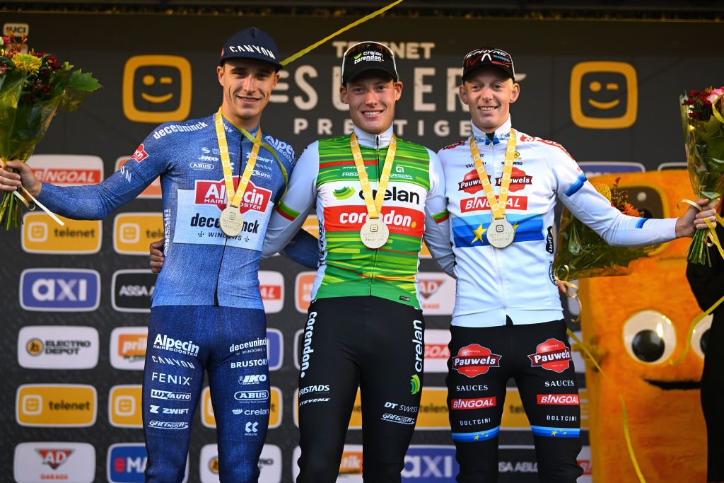 RUDDERVOORDE BELGIUM OCTOBER 20 LR Niels Vandeputte of Belgium and Team AlpecinDeceuninck on second place race winner Joran Wyseure of Belgium and Team CrelanCorendon and Michael Vanthourenhout of Belgium and Team Pauwels Sauzen Bingoal on third place pose on the podium ceremony after the 37th Superprestige Ruddervoorde 2024 Mens Elite on October 20 2024 in Ruddervoorde Belgium Photo by Luc ClaessenGetty Images