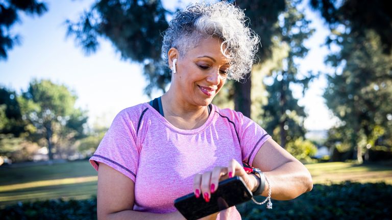 Woman on a run with a fitness tracker