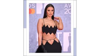 Maya Jama wears a black cut out dress as she attends The BRIT Awards 2022 at The O2 Arena on February 08, 2022 in London, England.