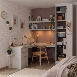 bedroom with fitted shelving and home office