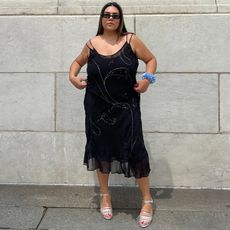 Fashion editor in black summer dress