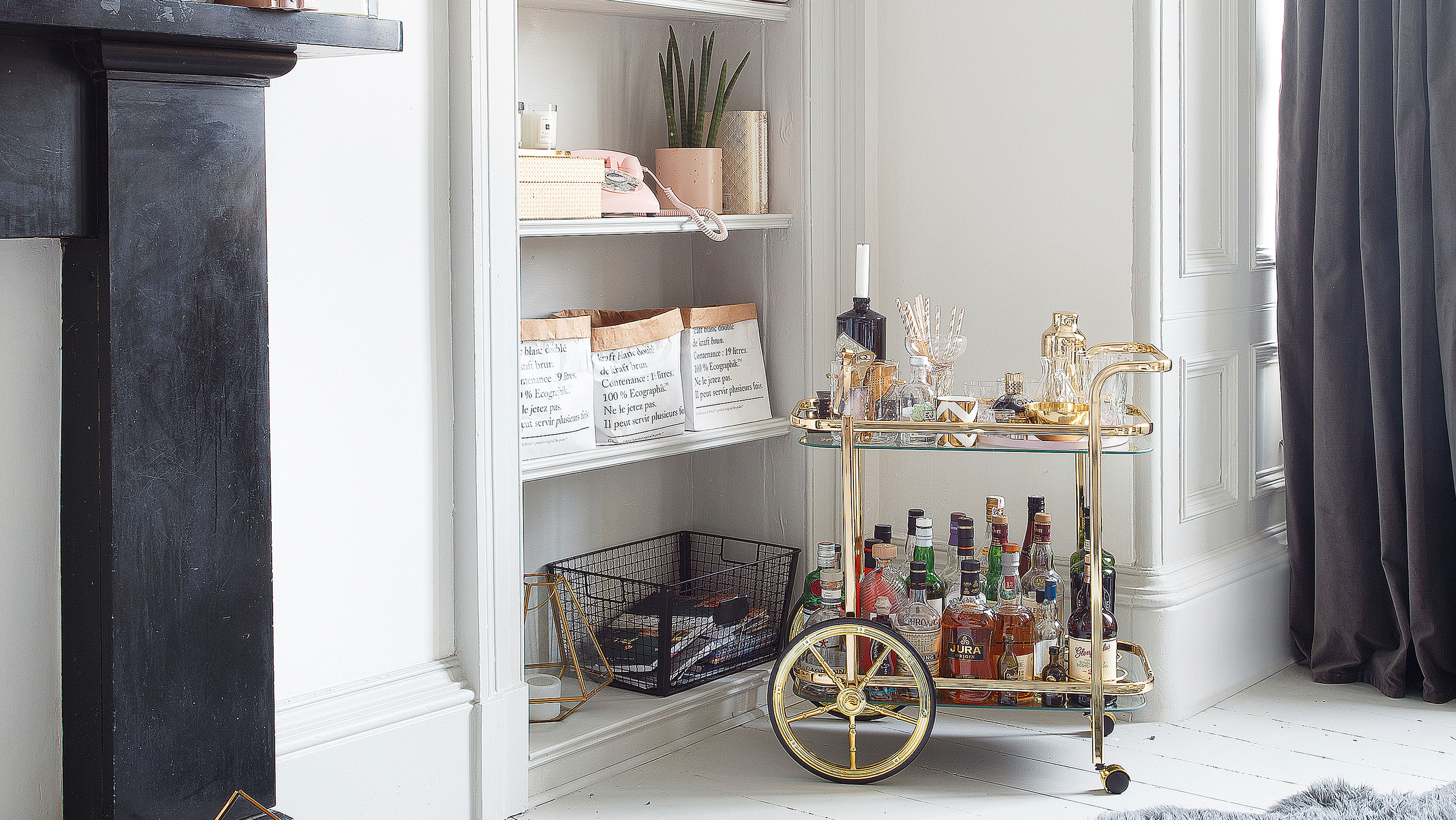 Gold trolley in a white living room 