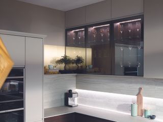 Modern kitchen with base and glass fronted wall cabinetry