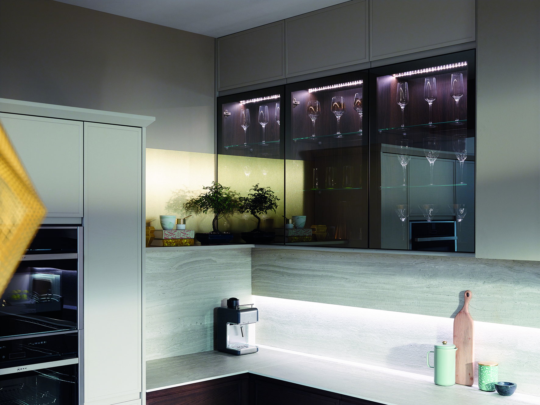 Modern kitchen with base and glass fronted wall cabinetry