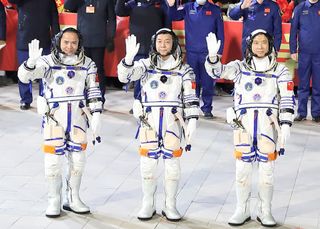 Chinese astronauts Zhang Lu, Deng Qingming and Fei Junlong of the Shenzhou-15 manned space mission attend a see-off ceremony at the Jiuquan Satellite Launch Center on November 29, 2022 in Jiuquan, Gansu Province of China.