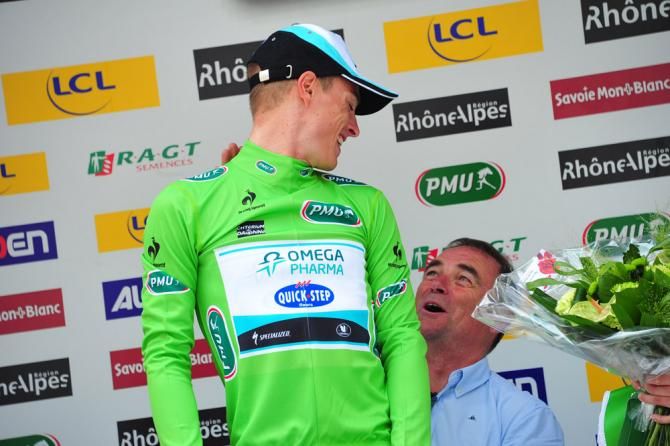 Points classification leader Gianni Meersman (Omega Pharma-QuickStep) gets some assistance with the green jersey from Bernard Hinault