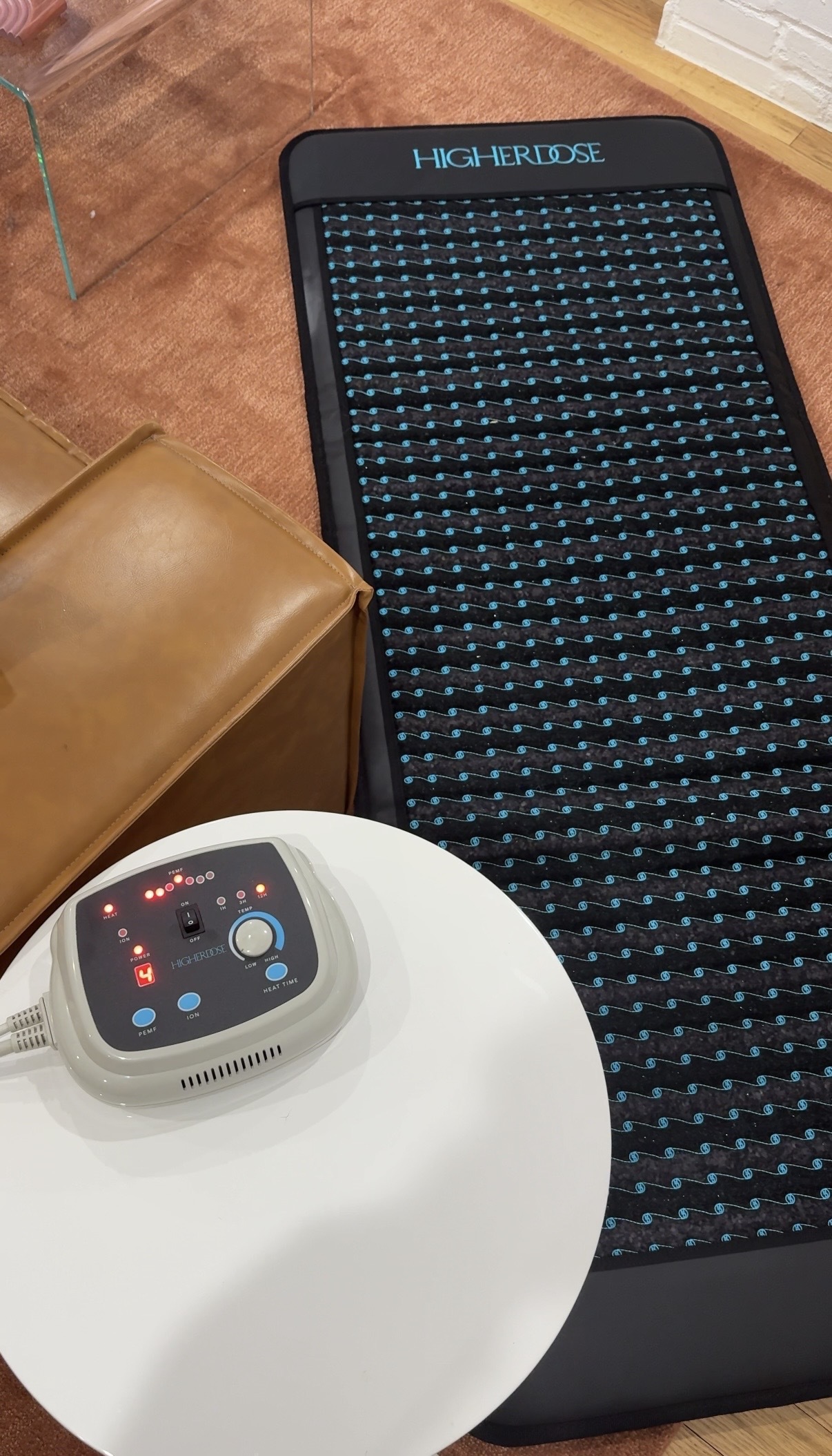 Photo of Jamie Schneider using HigherDose's PEMF Mat