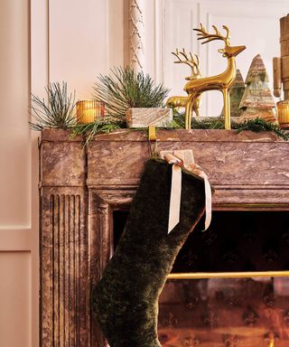 christmas mantel with stocking and decorative items