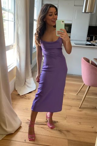 Zoe Anastasiou in a purple dress