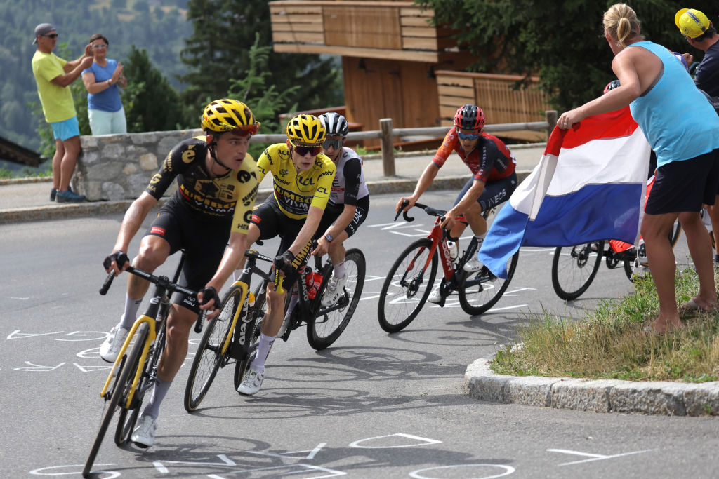 Jumbo-Visma's US rider Sepp Kuss (L) and Jumbo-Visma's Danish rider Jonas Vingegaard wearing the overall leader's yellow jersey cycles in the ascent of Col de la Loze during the 17th stage of the 110th edition of the Tour de France cycling race, 166 km between Saint-Gervais Mont-Blanc and Courchevel, in the French Alps, on July 19, 2023. (Photo by Thomas SAMSON / AFP)