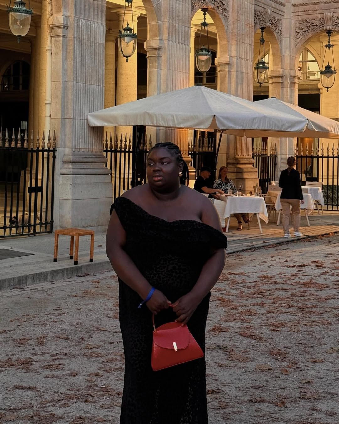 @abimarvel wearing a black off-the-shoulder dress