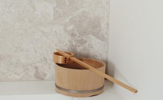 Wooden bowl and stick used for spa treatments