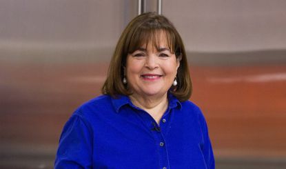 Ina Garten smiling in a cobalt blue button-down shirt