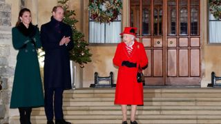 Catherine, Duchess of Cambridge, Prince William, Duke of Cambridge, Queen Elizabeth II, Prince Charles, Prince of Wales and Camilla, Duchess of Cornwall attend an event to thank local volunteers and key workers from organisations and charities in Berkshire, who will be volunteering or working to help others over the Christmas period in the quadrangle of Windsor Castle on December 8, 2020 in Windsor, England