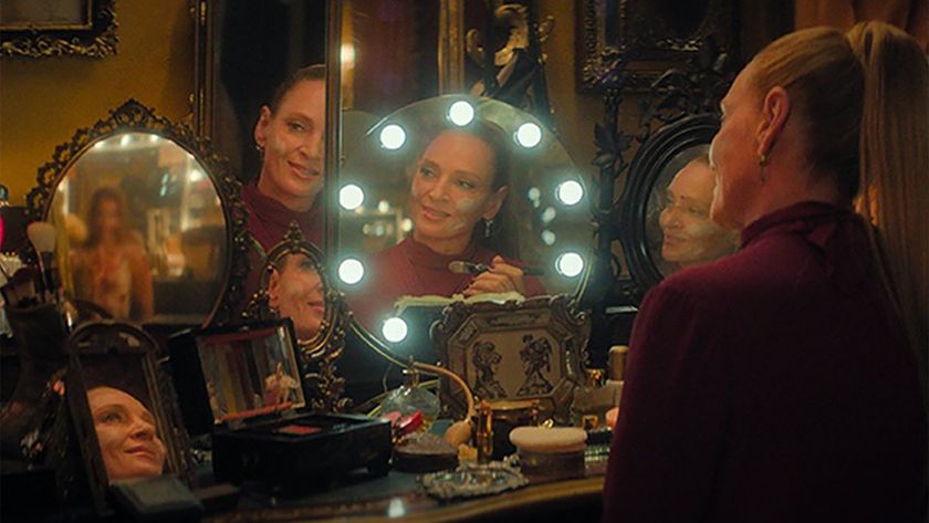 Uma Thurman's Devora Kasimer sitting at a make up table looking at a group of bloody ballerinas in her mirror