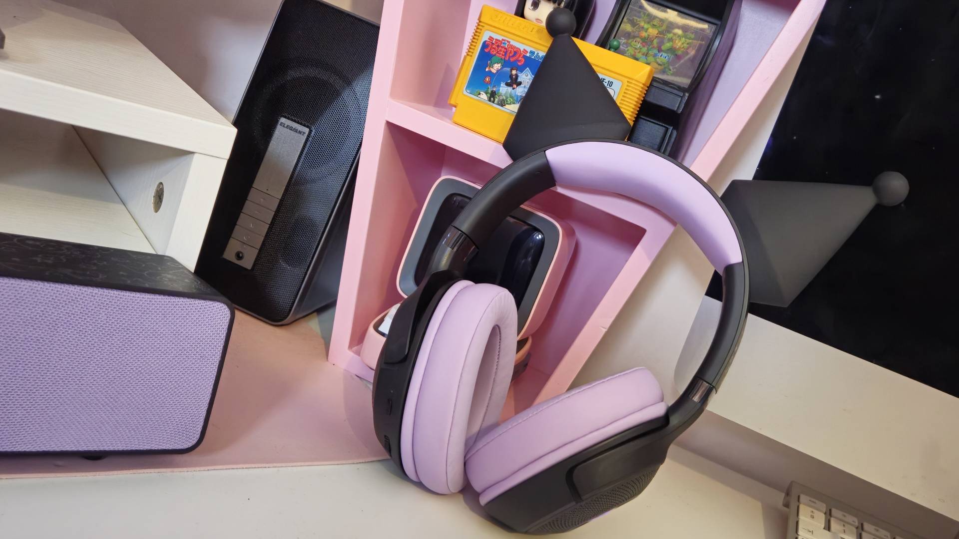 Photos taken by writer Rosalie Newcombe of the Razer Kraken Kitty V2 BT Kuromi Edition gaming headset, on a white desk. 