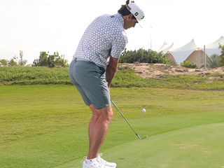 Rafa Cabrera Bello from behind after hitting a pitch shot