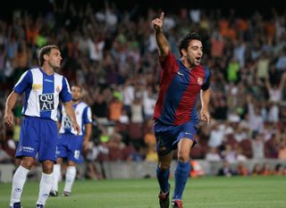 Xavi celebrates a goal for Barcelona against Espanyol in the Supercopa de España in August 2006.