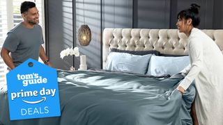 Prime Day queen bedding deals, featuring a couple making their bed with Olive + Crate Luxury Bed Sheet Set with Prime Day tag in lower left corner