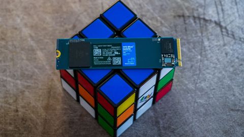 WD Blue SN570 on and around a Rubik's cube