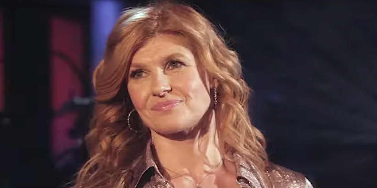 Connie Britton smiles on stage in Nashville