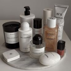 Platter displaying Byredo and Chanel products.