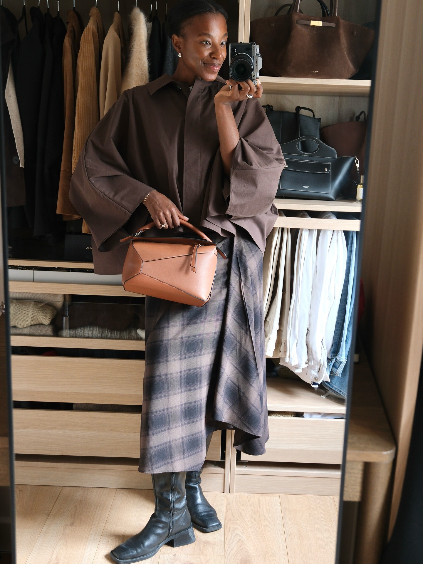 Photo of influencer wearing checkered plaid maxi skirt.