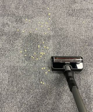 Miele Duoflex vacuuming cereal and lentils on carpet in Future test center