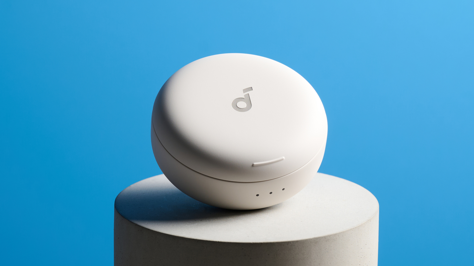 The Soundcore Sleep A30 earbuds case on a stone plinth against a blue background