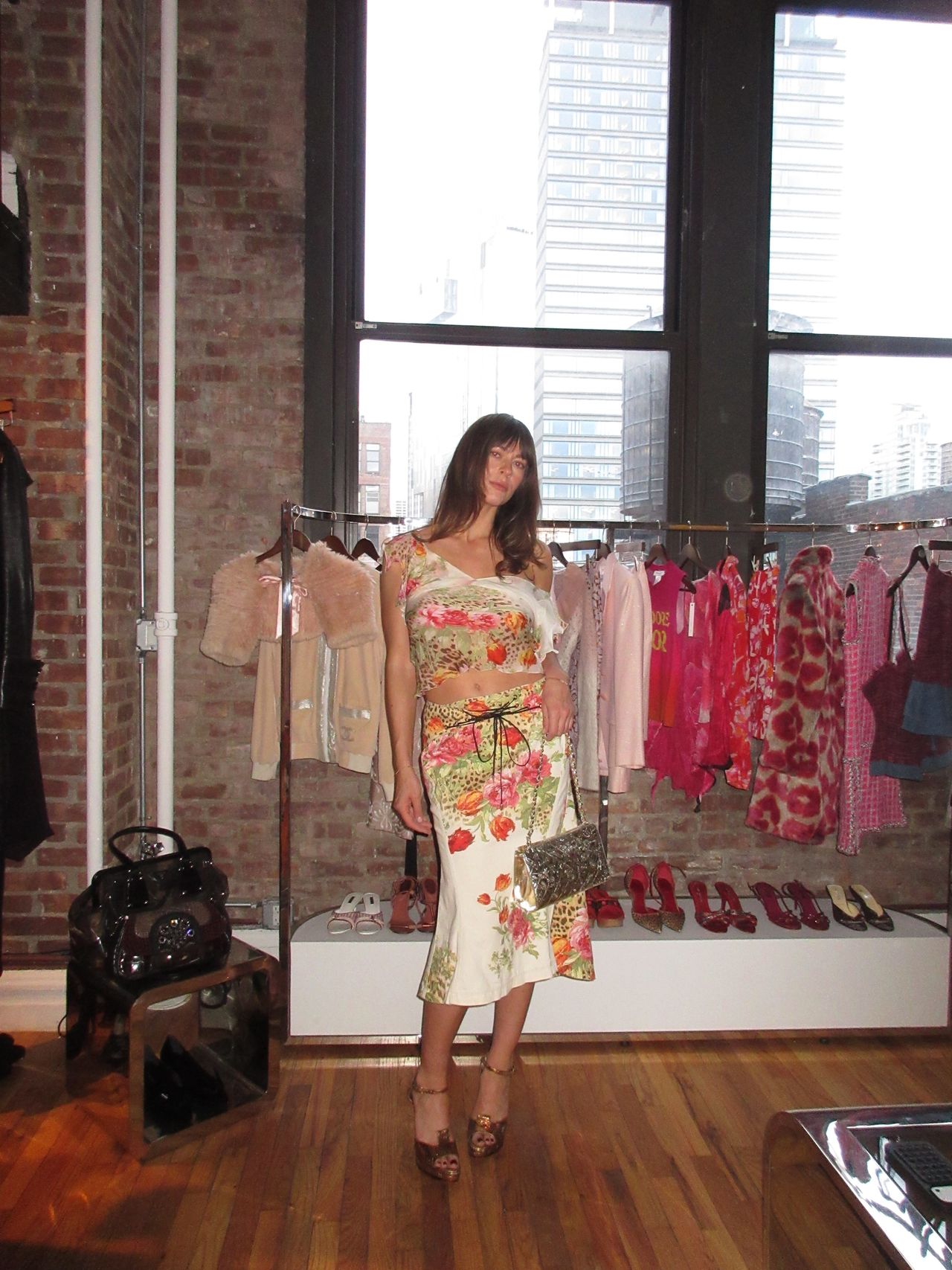 Kathryn zahorak wearing floral leopard print top and skirt with silver bag