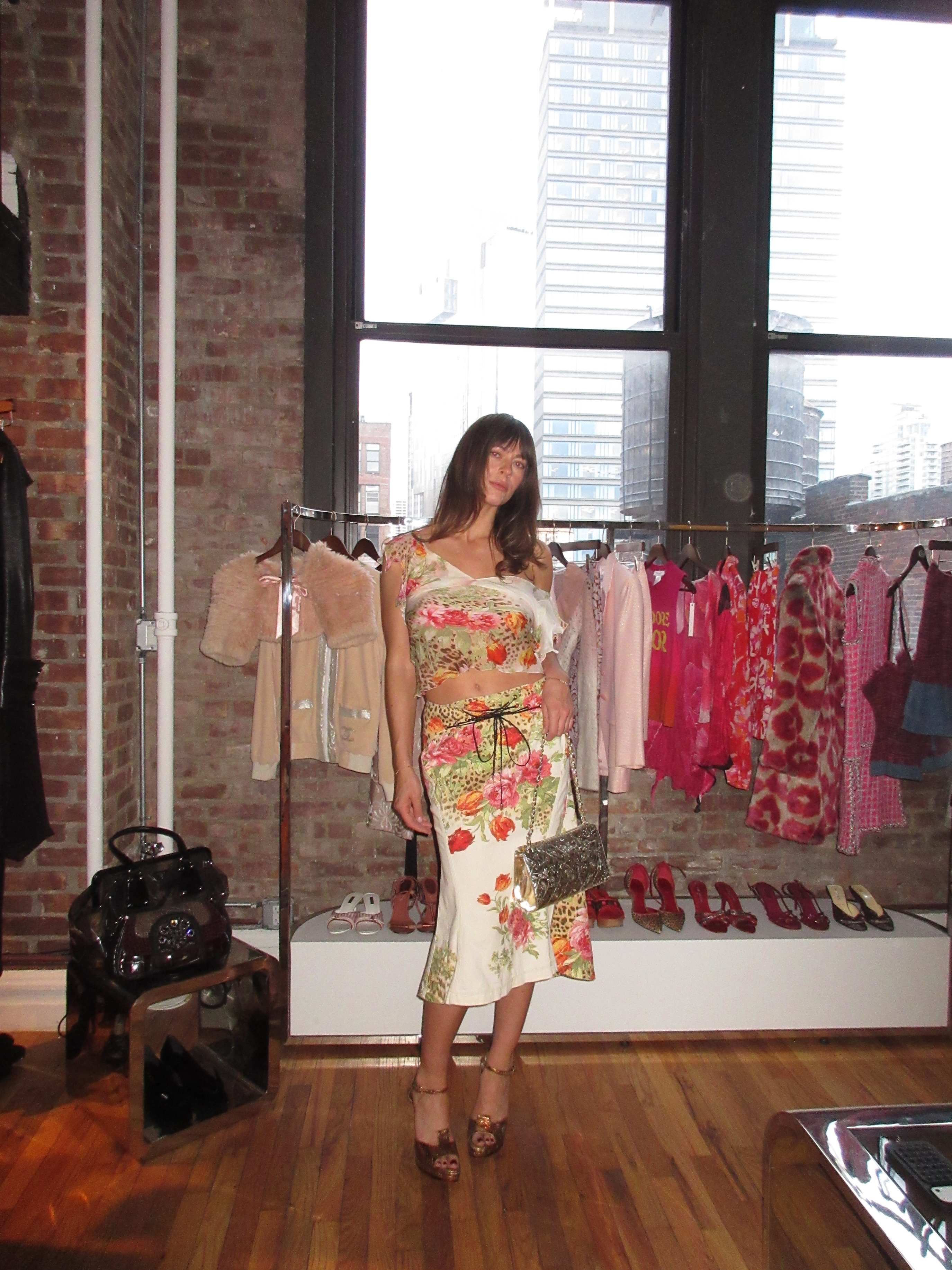 Kathryn zahorak wearing floral leopard print top and skirt with silver bag