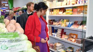 Prince Harry, Duke of Sussex and Meghan, Duchess of Sussex, view products displayed for sale as they officially open 'Number 7', a 'Feeding Birkenhead' citizens' supermarket and community cafe, during their visit to Birkenhead, northwest England on January 14, 2019.