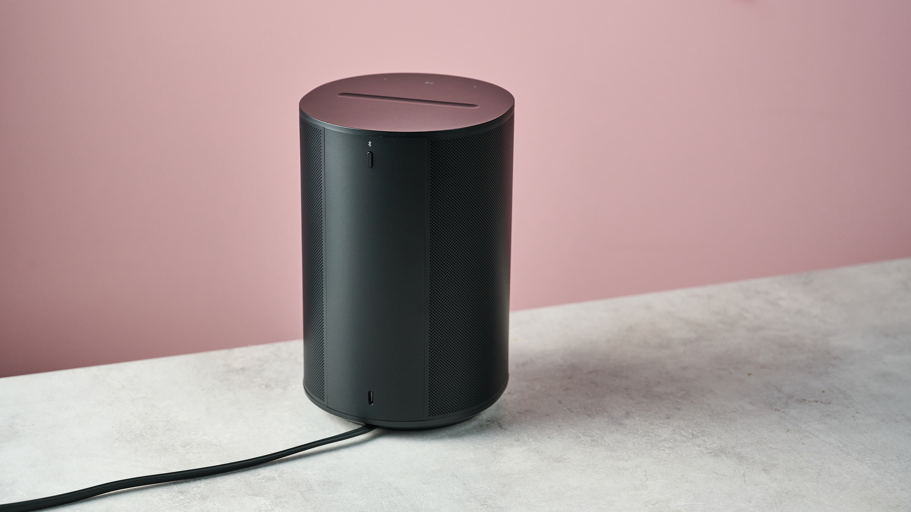 The Sonos Era 100 SL with the power cable plugged in.