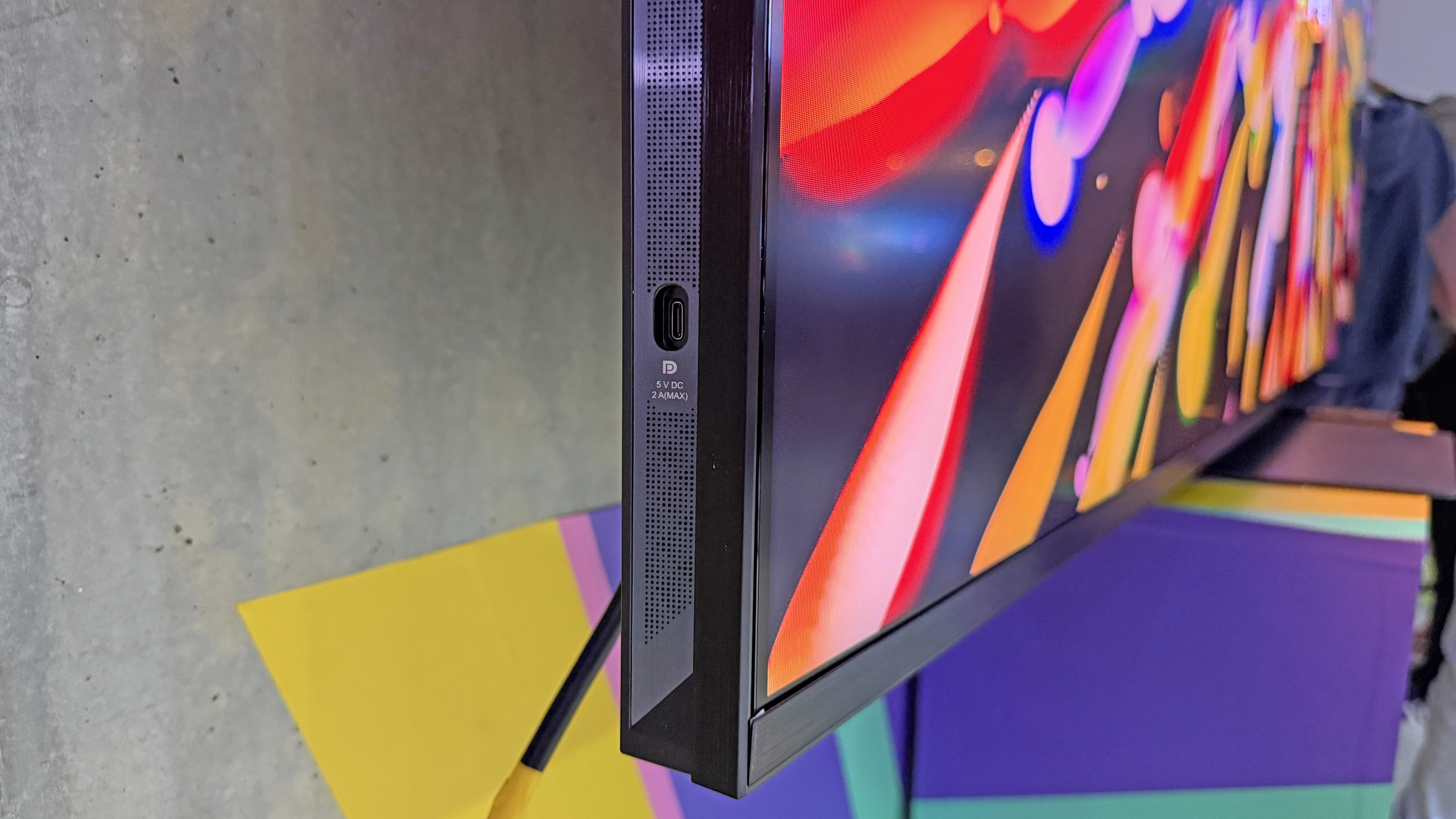 The DisplayPort USB-C connection on the Hisense UR9 TV, showing how the connection is conveniently on the side of the TV's frame, and not on the back with its other ports