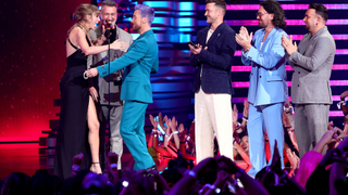 Taylor Swift accepts the Best Pop award for "Anti-Hero" from Joey Fatone, Lance Bass, Justin Timberlake, JC Chasez, and Chris Kirkpatrick of *NSYNC onstage the 2023 MTV Video Music Awards at Prudential Center on September 12, 2023 in Newark, New Jersey
