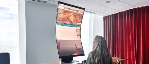 Samsung Odyssey Ark shown vertical on a desk