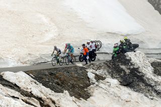leaders climb amid the snow during stage 19 at the Giro d'Italia