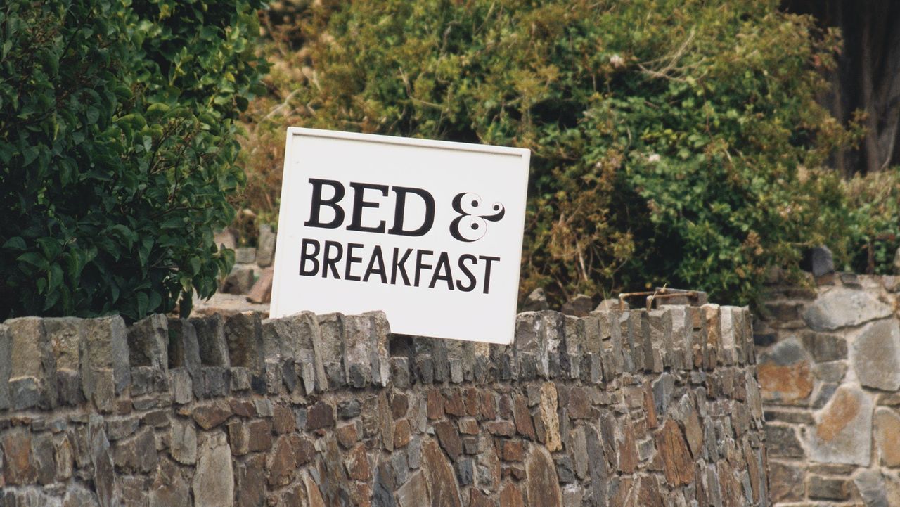 Bed &amp;amp; Breakfast sign on stone wall