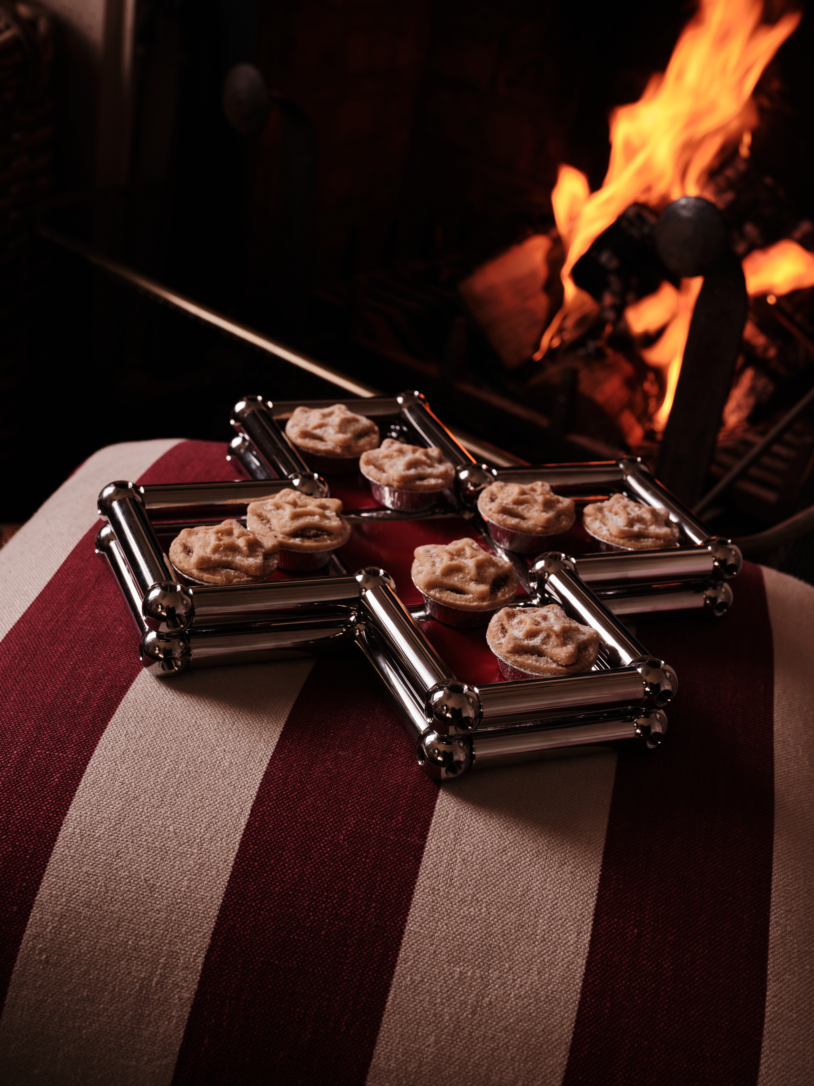 A series of shots depicting a festive Christmas tree, flowers, candles, and accessories setup.