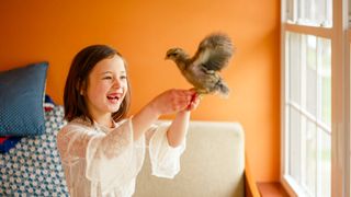 Child holding bird