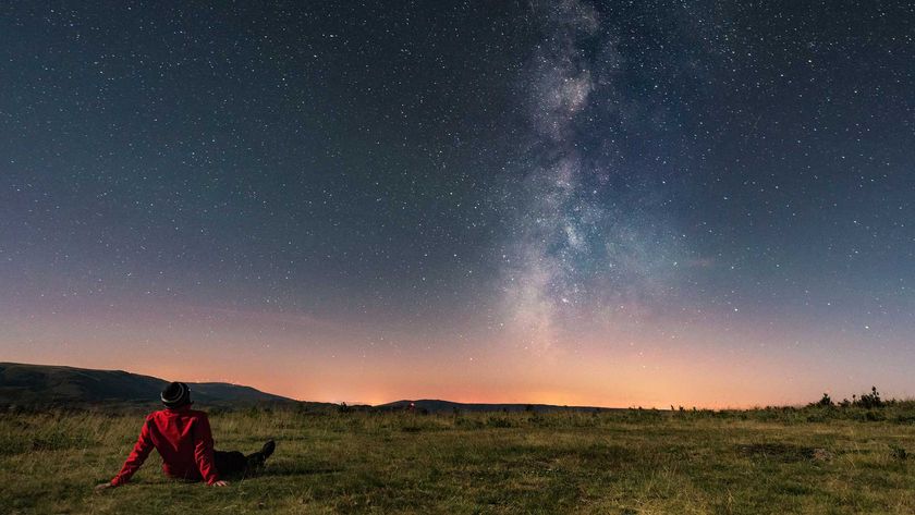 Man under night sky with milky way